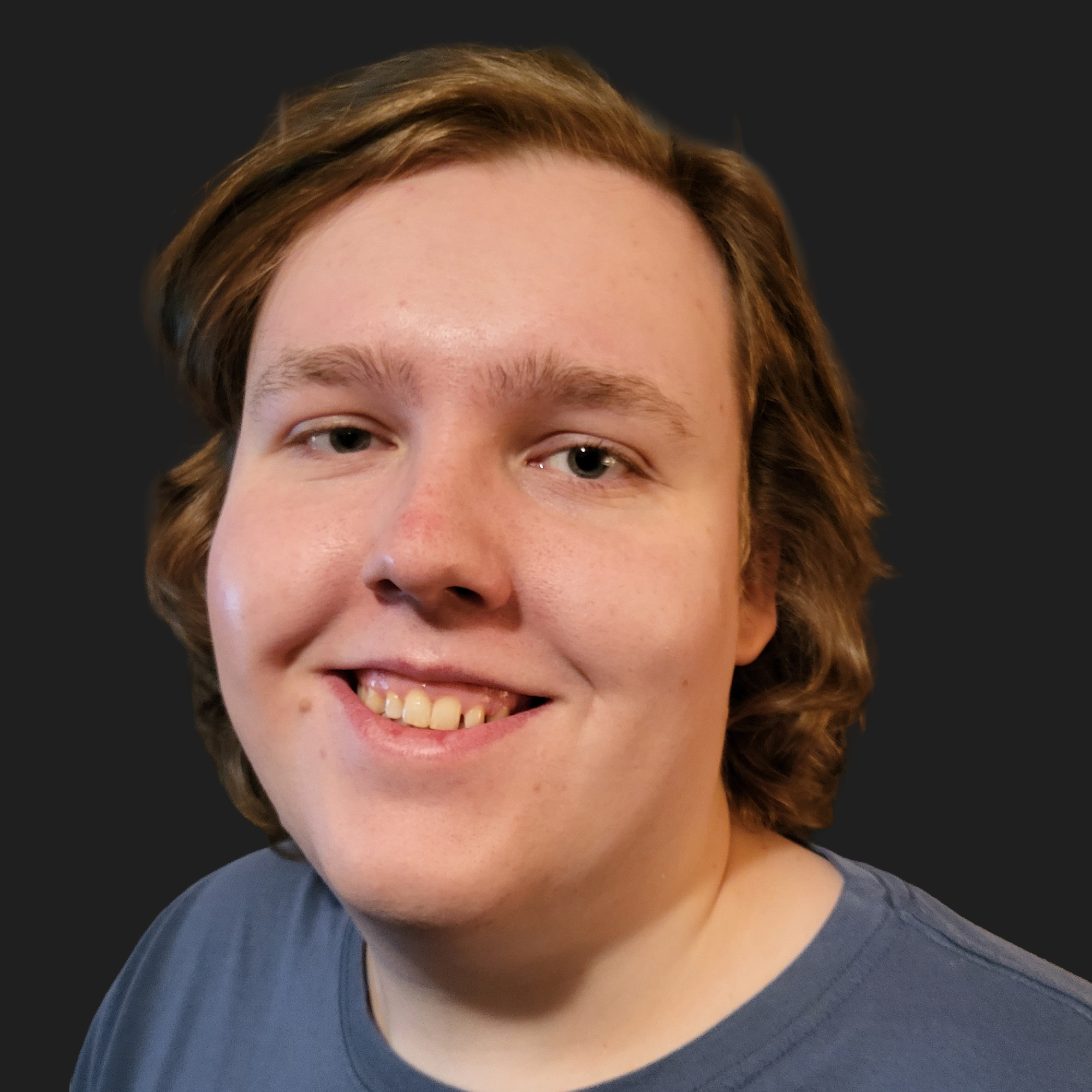 young man with long dirty blonde hair and a blue shirt